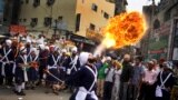 A Sikh youth performs an act of fire as he displays martial art skills during a religious procession on the eve of birth anniversary of Guru Ram Das in Amritsar, India. Ram Das was the fourth of the ten gurus of Sikhism.