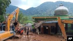 Rescuers search for missing people after a deadly landslide in Karo, North Sumatra, Indonesia, Nov. 25, 2024.