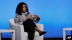 Former U.S. first lady Michelle Obama speaks during an event in Kuala Lumpur, Malaysia, Dec. 12, 2019.