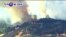 VOA60 America - New Wind-Driven Wildfire Erupts in Southern California