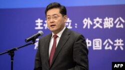 FILE - This photo taken on December 25, 2013 shows then director of the Foreign Ministry Information Department of China Qin Gang speaking during an event in Beijing.