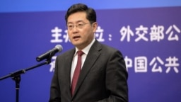 FILE - This photo taken on December 25, 2013 shows then director of the Foreign Ministry Information Department of China Qin Gang speaking during an event in Beijing.