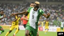 FILE — Nigeria's Victor Osimhen controls the ball during the World Cup 2022 qualifying football match between Nigeria and Ghana at the National Stadium in Abuja on March 29, 2022.