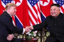 FILE - U.S. President Donald Trump and North Korean leader Kim Jong Un shake hands before their one-on-one chat during the second U.S.-North Korea summit at the Metropole Hotel in Hanoi, Vietnam, Feb. 27, 2019.
