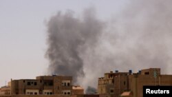 FILE - Smoke is seen rise from buildings during clashes between the paramilitary Rapid Support Forces and the army in Khartoum North, Sudan, April 22, 2023. 