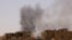 FILE - Smoke is seen rise from buildings during clashes between the paramilitary Rapid Support Forces and the army in Khartoum North, Sudan, April 22, 2023. 