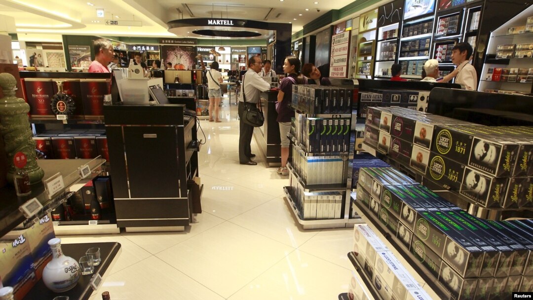 FILE - Chinese tourists shop in the Everrich duty free shopping mall in Kinmen county, Taiwan, Sept. 8, 2015.