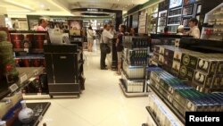 FILE - Chinese tourists shop in the Everrich duty free shopping mall in Kinmen county, Taiwan, Sept. 8, 2015.