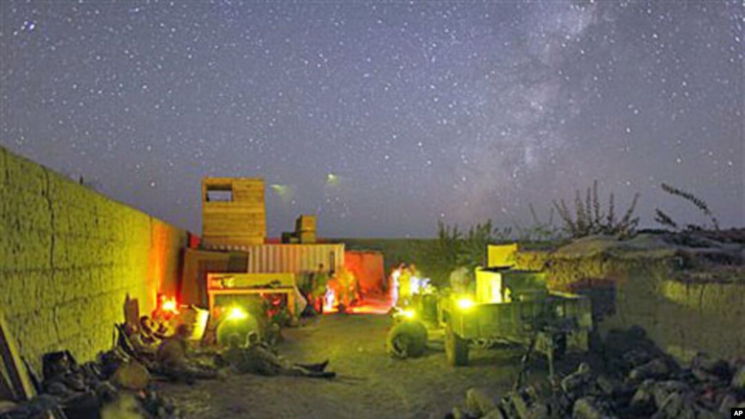 US Marines lie down inside a small patrol base during a pause in an all night mission in Helmand province, southern Afghanistan, October 2009. (file photo)