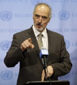 Syrian Ambassador to the United Nations Bashar Ja'afari speaks to reporters after a meeting about Syria at United Nations headquarters, New York, Aug. 28, 2013.