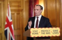 FILE - A handout image released by 10 Downing Street, shows Britain's Foreign Secretary Dominic Raab speaking during a remote press conference to update the nation on May 5, 2020.