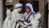 A tapestry depicting Mother Teresa of Calcutta is seen in the facade of Saint Peter&#39;s Basilica during a mass, celebrated by Pope Francis, for her canonization in Saint Peter&#39;s Square at the Vatican, Sept. 4, 2016.