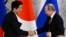 Russia's President Vladimir Putin (R) shakes hands with Japan's Prime Minister Shinzo Abe during a signing ceremony at the Kremlin in Moscow, April 29, 2013.