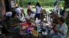 Volunteers restore used toys to donate them to vulnerable children as Christmas presents, at the non-profit foundation Hospital de los Peluches, or Hospital of Stuffed Animals, in Caracas, Venezuela, Thursday, Dec. 5, 2024. (AP Photo/Ariana Cubillos)