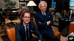 Designer Ralph Lauren (r) poses in his office accompanied by Stefan Larsson, global president of Old Navy, Sept. 29, 2015, in New York. 
