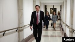 FILE - Intelligence Community Inspector General Michael Atkinson leaves after testifying at a House Intelligence Committee hearing on a whistleblower complaint about President Donald Trump's Ukraine dealings, on Capitol Hill in Washington, Oct. 4, 2019.