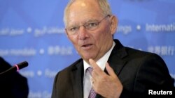 FILE - German Finance Minister Wolfgang Schaeuble speaks during a news conference at the 2016 World Bank-IMF Spring Meeting in Washington, April 16, 2016. 