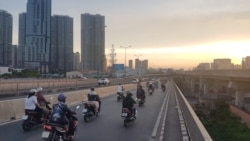 FILE - Vietnam is the fourth biggest market in the world for motorbikes, which millions of drivers like these in Ho Chi Minh City rely on daily.