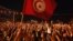 People gather outside the Constituent Assembly headquarters during a protest to demand the ouster of the Islamist-dominated government, in Tunis July 28, 2013. 