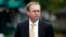 FILE - Mick Mulvaney departs after a television interview at the White House, Sept. 13, 2017, in Washington.