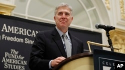 FILE - Supreme Court Justice Neil Gorsuch speaks at the 50th anniversary of the Fund for America Studies luncheon in Washington, Sept. 28, 2017. 