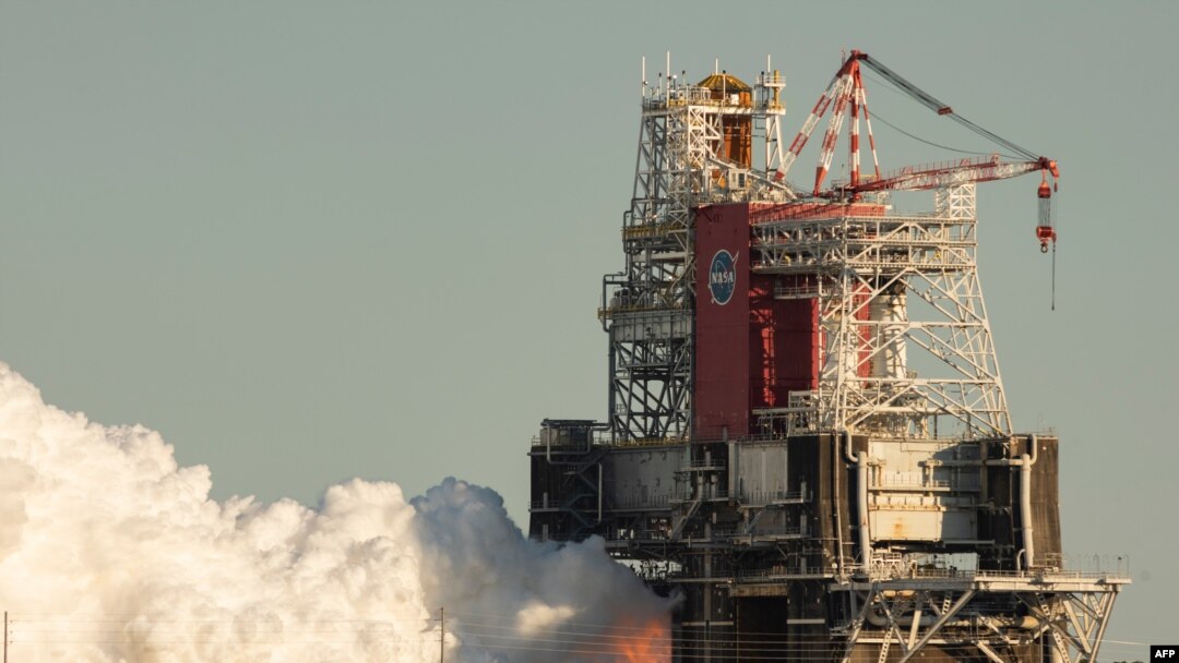 This NASA handout photo shows the core stage for the first flight of NASA’s Space Launch System rocket during a scheduled fire test, Jan. 16, 2021, at NASA’s Stennis Space Center near Bay St. Louis, Miss.