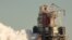 This NASA handout photo shows the core stage for the first flight of NASA’s Space Launch System rocket during a scheduled fire test, Jan. 16, 2021, at NASA’s Stennis Space Center near Bay St. Louis, Miss.