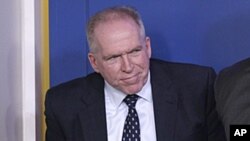 John Brennan exits a daily news briefing at the White House, May 2, 2011