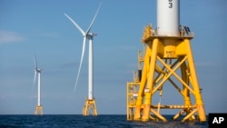 FILE - Three wind turbines from the Deepwater Wind project off Block Island, Rhode Island, are seen Aug. 15, 2016. 