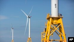 FILE - Three wind turbines from the Deepwater Wind project stand off Block Island, R.I., Aug. 15, 2016.