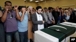 Funeral prayers are offered for Pakistani exchange student Sabika Sheikh, who was killed in the Santa Fe High School shooting, during a service at the Brand Lane Islamic Center Sunday, May 20, 2018, in Stafford, Texas. (AP Photo/David J. Phillip)