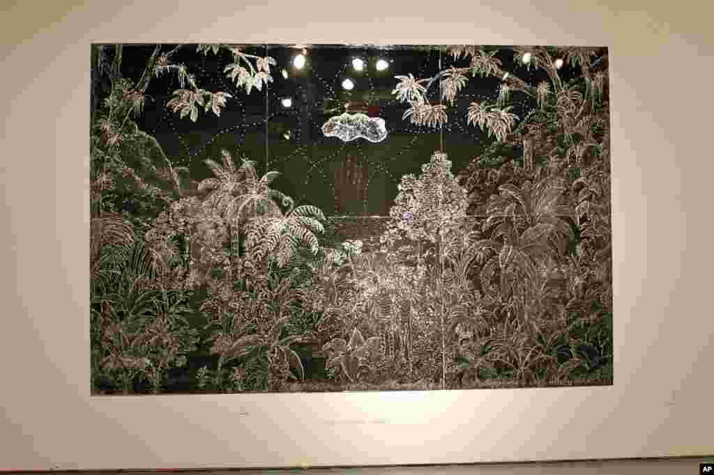 Duval-Carrié created this nearly 2.5 meter by more than 3.5 meter Caribbean scene, called Silver Landscape, using glitter glue, a material commonly used by children.