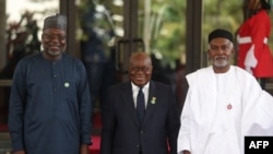 ECOWAS president Omar Touray (L), Ghana President Nana Akufo-Addo (C), and Nigerian Minister of Foreign Affairs Yussuf Tuggar at the ECOWAS 66th Ordinary Session of the Authority of Heads of States and Government in Abuja on Dec. 15, 2024. 