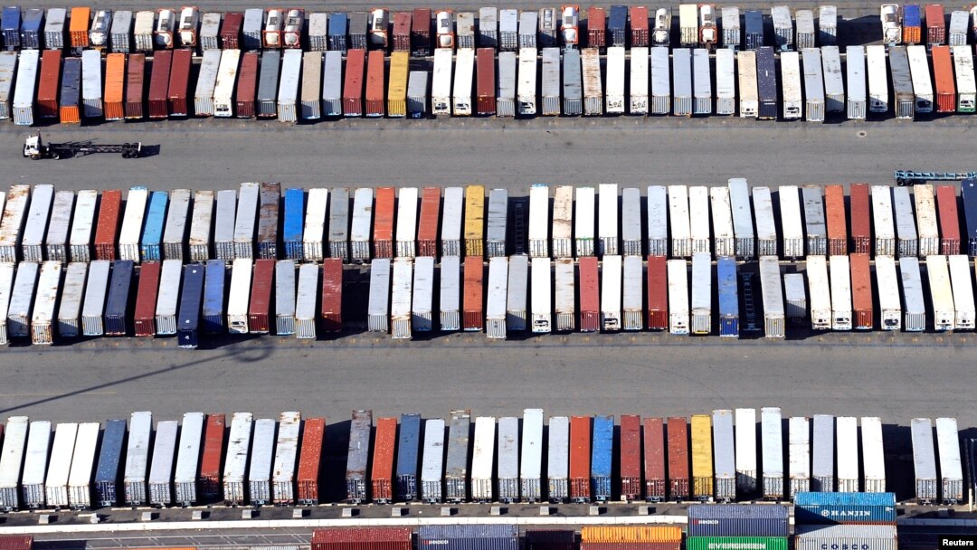 FILE - Containers are seen stacked up at the ports of Los Angeles and Long Beach, California, Feb. 6, 2015 in this aerial image. 