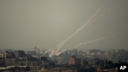 Smoke trails of rocket fired by Palestinian militants from Gaza Strip towards Israel, October 24, 2012. 