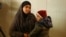 FILE - Hoda Muthana is seen with her son is this undated photo.