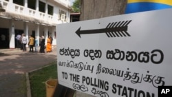 People queue up to cast their votes at a polling station during the parliamentary election in Colombo, Sri Lanka, Nov. 14, 2024.