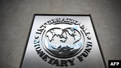 FILE - The seal of the International Monetary Fund is at the headquarters building in Washington, DC, April 12, 2024, in Washington, DC, ahead of the IMF/World Bank 2024 Spring Meetings. (Photo by MANDEL NGAN / AFP)