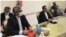 This combined photo released by the Iranian Foreign Ministry, shows Iranian diplomats attending a virtual talk on nuclear deal with representatives of world powers, in Tehran, Iran, Friday, April 2, 2021. The chair of the group including the European Unio