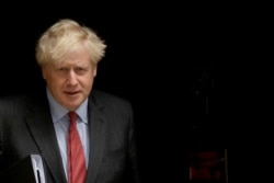 British Prime Minister Boris Johnson leaves 10 Downing Street, in London, to go to the Houses of Parliament to make a statement on new coronavirus restrictions Sept. 22, 2020.