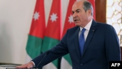 A handout picture released by the Jordanian Royal Palace on Sept. 28, 2016 shows Jordan's Prime Minister Hani Mulki taking a oath at the swearing in ceremony of Jordan's new government in Amman.