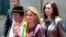 Bolivia's interim president Jeanine Anez (C), new Minister of Culture Martha Yujra (L) and new Foreign Minister Karen Longaric attend a ceremony in La Paz, Bolivia, Nov. 18, 2019. 