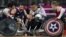  Japan's Shin Nakazato (C) holds onto the ball as Chuck Aoki of the US (L) closes in during the bronze medal Wheelchair Rugby match between USA and Japan, in London, September 9, 2012. 