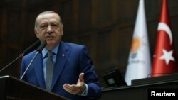 Turkish President Tayyip Erdogan addresses members of parliament from his ruling AK Party (AKP) during a meeting at the Turkish parliament in Ankara, Oct. 30, 2018. (Presidential Press Office/Handout via Reuters)