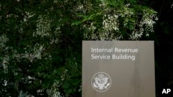 FILE - A sign for the Internal Revenue Service building in Washington, on May 4, 2021.