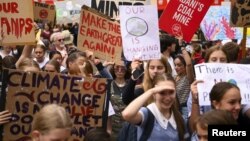 Students are seen attending a "Climate Strike" protest in Canberra, Australia, March 15, 2019. 