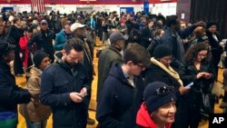 Voters line up in crowds at a polling site to cast their ballots, Nov. 8, 2016, in the Flatbush section of Brooklyn in New York. 