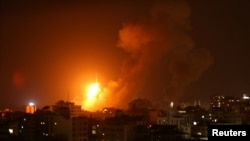 An explosion is seen during an Israeli air strike in Gaza City, Aug. 8, 2018. 