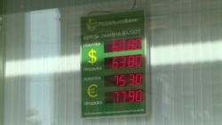 Russian Officials Claim Currency Plunge Is Temporary