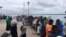 Travellers are seen gathered at the Lamu jetty following an attack by Somalia's Islamist group al-Shabab on a military base in Manda, Lamu, Kenya, Jan. 5, 2020. 